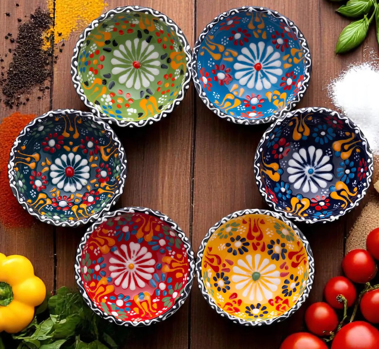 Six colourful hand-painted ceramic bowls arranged in a circle