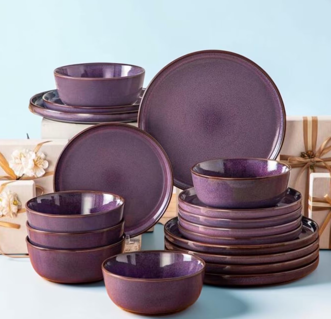 Plum purple stoneware dinner set with plates and bowls stacked